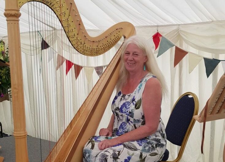 photo of Xenia Horne, harpist, and her harp
