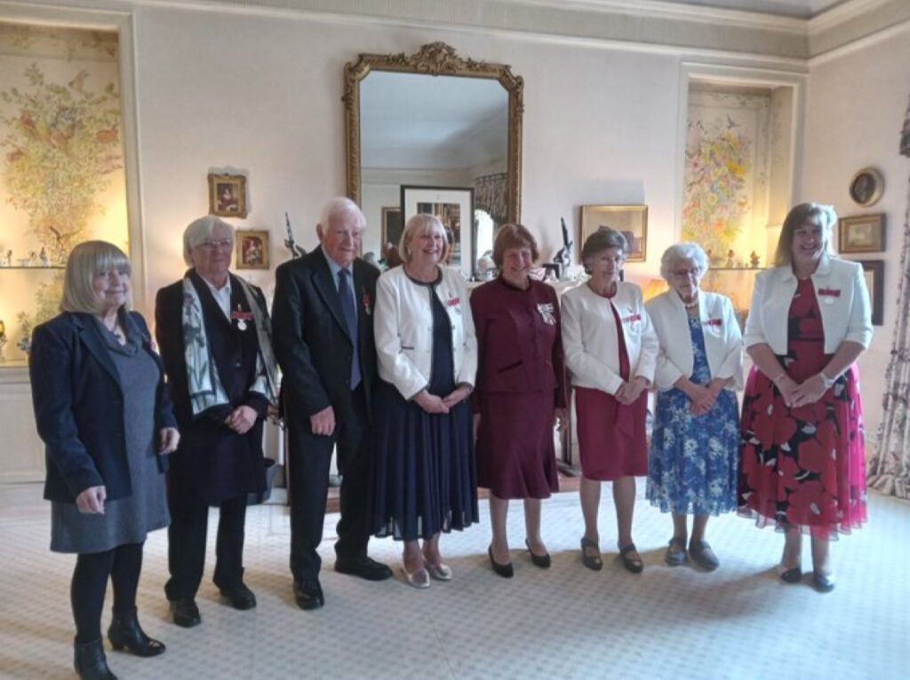 Photo of Ann and others at B.E.M. award ceremony