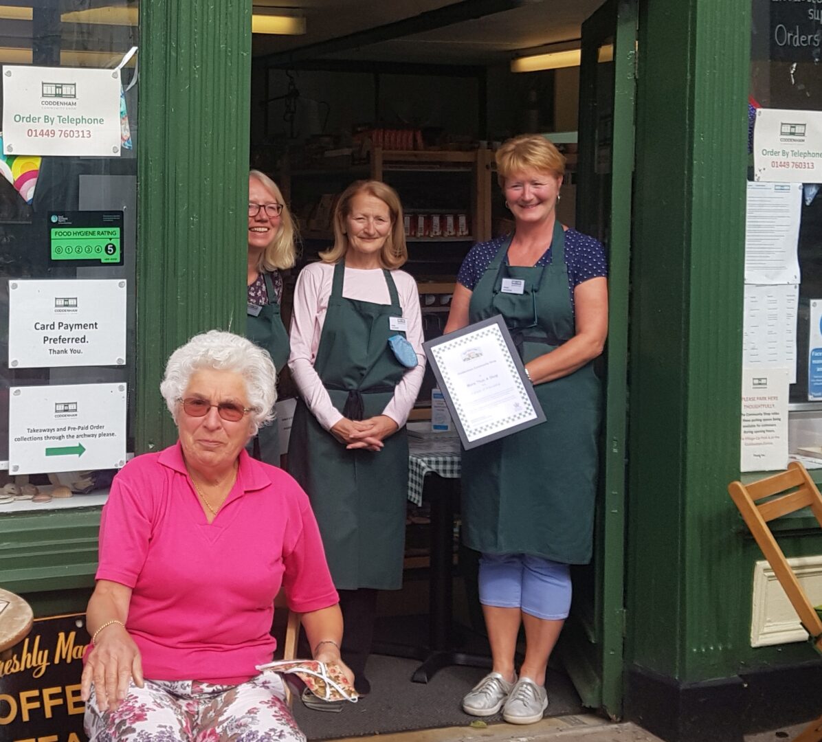 Coddenham Community Shop's team and a customer!