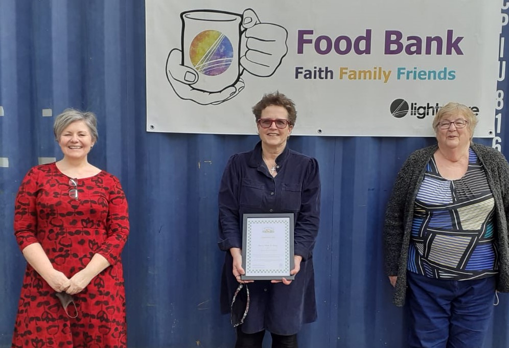 Lightwave Cafe & Food Bank teamreceiving their More Than A Shop certificate