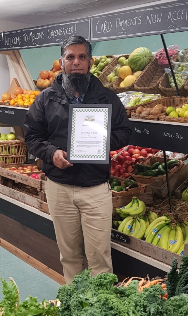 Melons Greengrocers receiving their More Than A Shop certificate