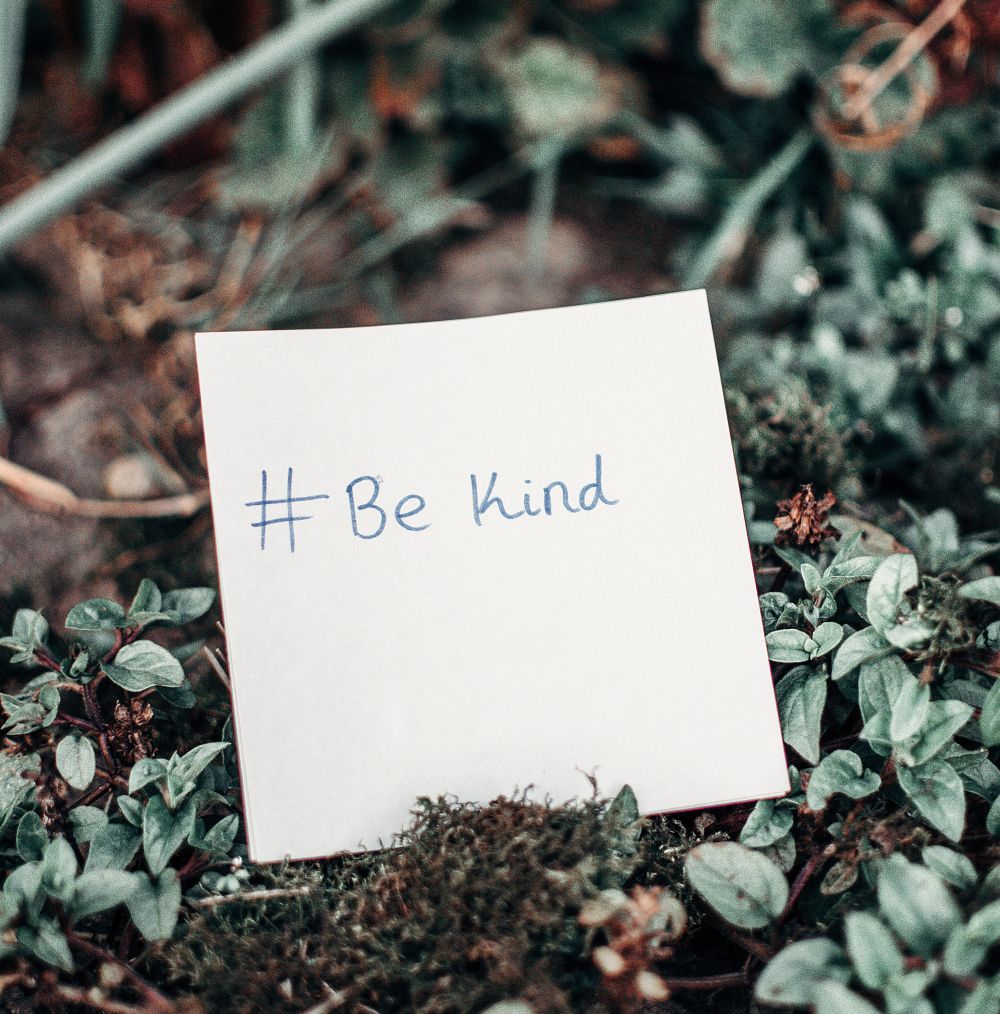 #BeKind note placed in the earth