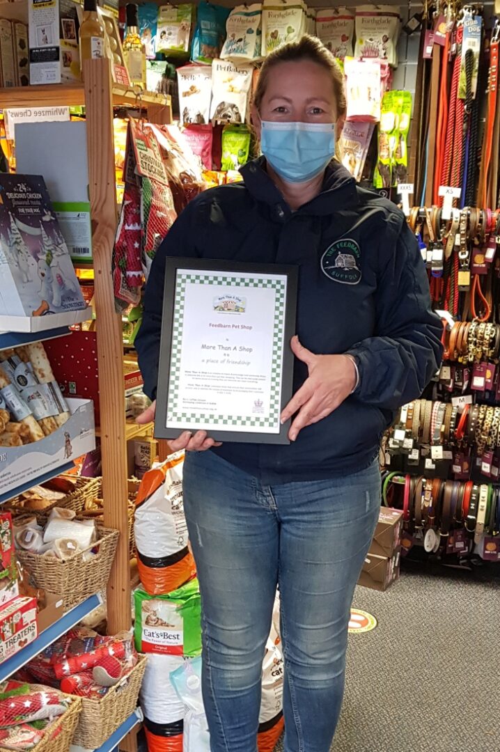 the Feedbarn Pet Shop receiving their More Than A Shop award